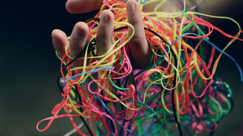 Untangling SEO Blog Image Colourful threads, all tangled with each other